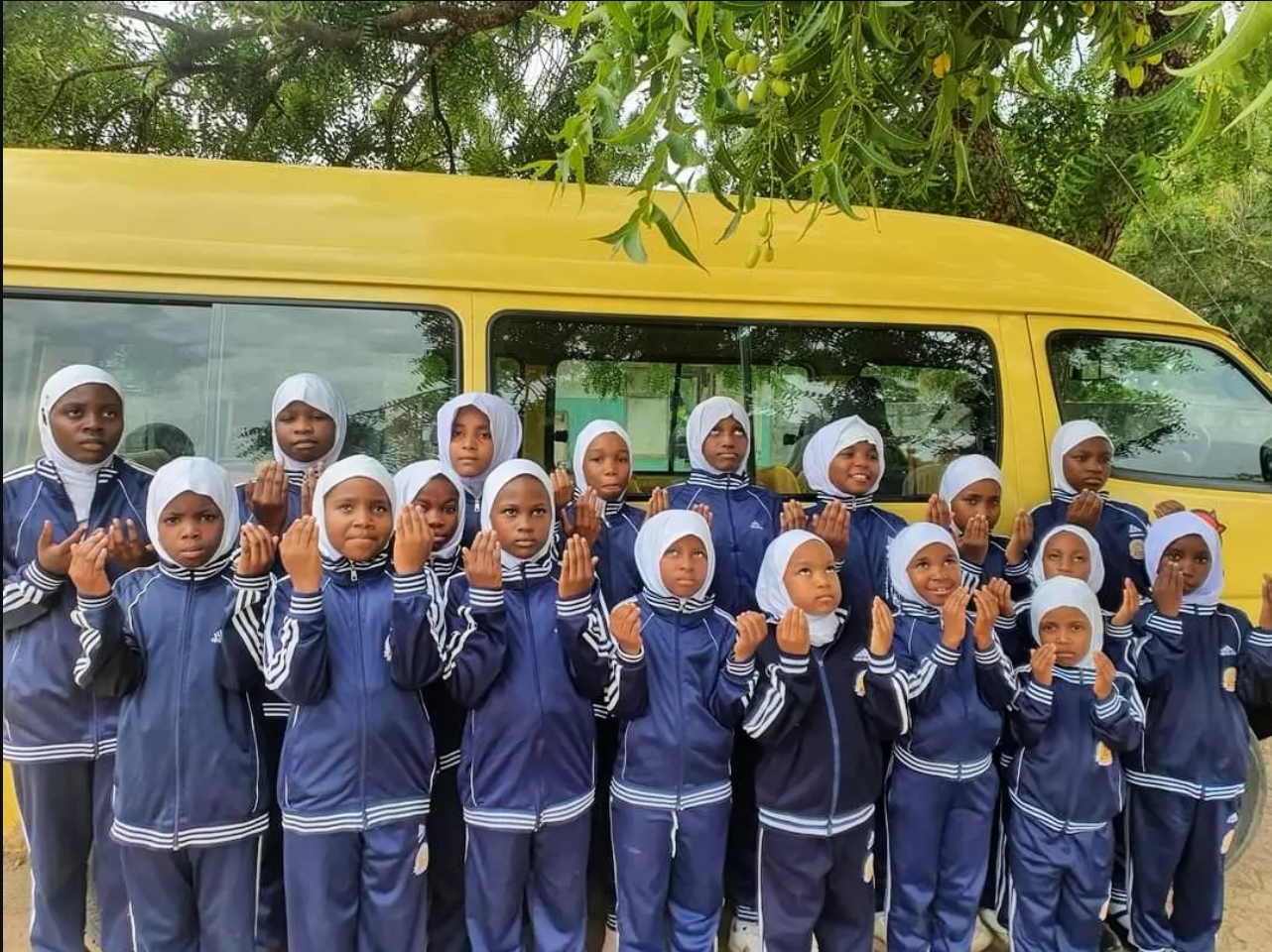 Victoria Schools students by the school bus